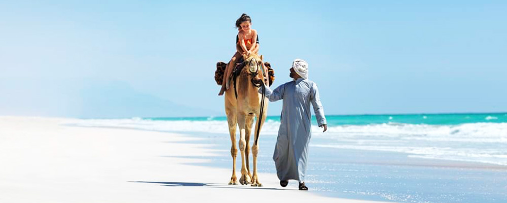 visit oman, camel riding